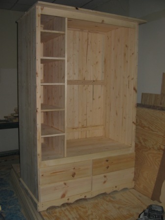 inside armoire with shelves